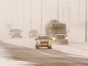 Drivers make their way into Edmonton along Baseline Road as a winter storm hits the area on Nov. 27, 2014. Edmonton could get up to 30 cm by Friday.