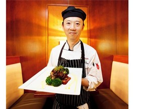 Jimmy Ng, executive chef at Wildflower, with Tournedos Rossini, a classic French steak dish, on Sept. 18, 2014 in Edmonton