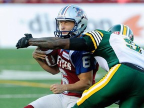 Edmonton Eskimos cornerback Patrick Watkins was penalized for this high hit on Montreal Alouettes kicker Sean Whyte during a Canadian Football League game at Molson Stadium in Montreal on Aug. 8, 2014.