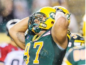 Edmonton Eskimos defensive tackle Eddie Steele reacts after a play against the Calgary Stampeders during a Canadian Football League game at Commonwealth Stadium on July 24, 2014.