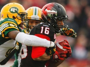 Edmonton Eskimos linebacker Alonzo Lawrence was unable to stop Calgary Stampeders receiver Marquay McDaniel from scoring the first touchdown in the opening quarter of Sunday’s Canadian Football League West Division final at Calgary’s McMahon Stadium.