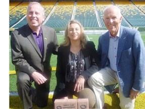 Edmonton Eskimos president Len Rhodes, Valour Place executive director Lydia Migus and Dennis Erker, the Loyal Edmonton Regiment’s honourary colonel, display fundraising bricks that can be bought Sept. 26 when the Esks host the Roughriders.