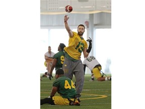 Edmonton Eskimos quarterback Mike Reilly throws the ball against the Saskatchewan Roughriders during Western semifinal action at Commonwealth Stadium on Nov. 16, 2014, in Edmonton.