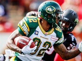Edmonton Eskimos receiver A.J. Guyton runs the ball against the Calgary Stampeders during the annual Labour Day Classic at Calgary’s McMahon Stadium on Monday, Sept. 1, 2014. The Eskimos lost the game 28-13.