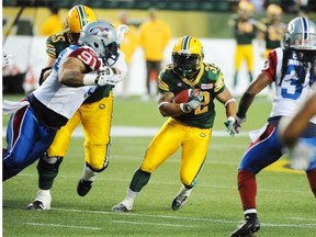 Edmonton Eskimos receiver/running back/kick-returner Kendial Lawrence looks for a seam in the Montreal Alouettes during a Canadian Football League game at Commonwealth Stadium on Sept. 12, 2014.