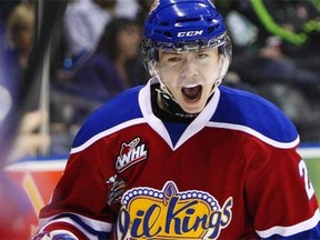 Edmonton Oil Kings Edgars Kulda comes back to the bench celebrating his goal against the London Knights during second period action at the Memorial Cup CHL hockey tournament in London, Ont., on Sunday, May 18, 2014.