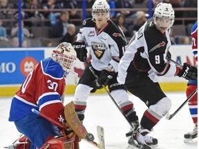 Edmonton Oil Kings netminder Tristan Jarry makes a save with his blocker en route to a shutout over the Vancouver Giants in a Western Hockey League at Rexall Place on Friday, Nov. 28, 2014.