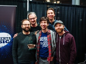 The Provincial Archive, who won the Edmonton Music Prize in 2014, with Alberta Music executive director Chris Wynters, top left.