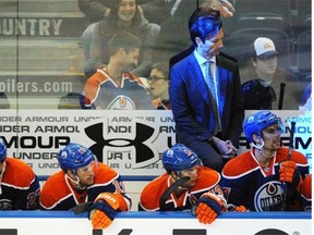 Edmonton Oilers bench, head coach Dallas Eakins and the players late in the third period against the Chicago Blackhawks during NHL action at Rexall Place in Edmonton, November 23, 2014. The Blackhawks won 7-1.