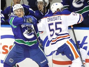Edmonton Oilers centre prospect Leon Draisaitl collides with Miles Liberati of the Vancouver Canucks during Friday’s game in the Young stars tournament at Penticton, B.C.