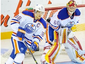 Edmonton Oilers defenceman Brandon Davidson skates with the puck during a Young Prospects exhibition game against the Winnipeg Jets at the South Okanagan Event Centre in Pentiction, B.C., on Sept. 7, 2013.