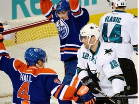 Edmonton Oilers forwards Taylor Hall and Jordan Eberle celebrate a goal in a National Hockey League game against the San Jose Sharks at Rexall Place on Jan. 30, 2014.