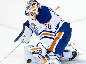 Edmonton Oilers goalie Ben Scrivens makes a save against the Vancouver Canucks during the second period of a pre-season NHL hockey game in Vancouver, B.C., on Saturday October 4, 2014.