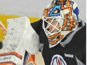 Edmonton Oilers goalie Viktor Fasth makes a blocker save during practice at Rexall Place in Edmonton, October 31, 2014.