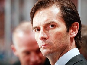 Edmonton Oilers head coach Dallas Eakins looks on from the bench during their NHL game against the Vancouver Canucks at Rogers Arena on Jan. 27, 2014, in Vancouver, B.C.