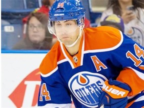 Edmonton Oilers Jordan Eberle moves the puck against the Chicago Blackhawks during the first period of an NHL pre-season hockey game in Saskatoon, Sunday, Sept 28, 2014.