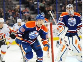 Edmonton Oilers rookie defenceman Brad Hunt watches the play during a National Hockey League pre-season game against the Calgary Flames at Rexall Place on Sept. 21, 2014.