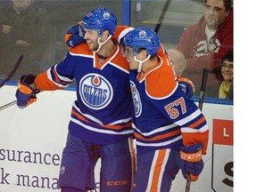 Edmonton Oilers winger Benoit Pouliot (left) celebrates his first period goal against the Montreal Canadiens with teammate David Perron (right) during first-period NHL game action earlier this week. The Oilers are 4-0-0 against Eastern Conference foes this season.