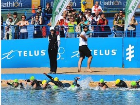 Elite paratriathlon athletes dive into the water at the World Triathlon Grand Final at Hawrelak Park on Aug. 30, 2014.
