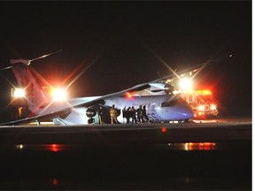 Emergency crews respond after a small plane had trouble landing at the Edmonton International Airport on Thursday, Nov. 6, 2014.