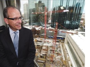 Enbridge COO Leon Zupan announced at a news conference Enbridge’s long-term city office plans, confirming tenancy agreements in the new Kelly Ramsey Tower still under construction (below) in Edmonton, Dec. 9, 2014. They will also increase their office space in the Manulife building (back) across the street.