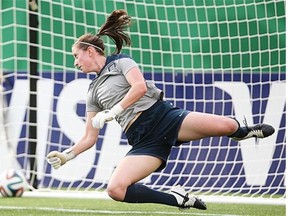 An England goalie dives for a ball during Tuesday’s practice at Commonwealth Stadium. England plays Nigeria in a Group C match at 6 p.m. Wednesday in the U-20 Women’s World Cup.