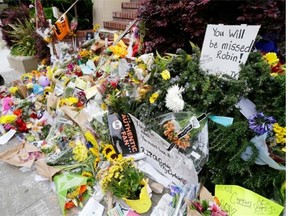 This makeshift memorial was set up Aug. 15 outside the San Francisco home where the late actor Robin Williams filmed the movie Mrs. Doubtfire. Studies show responsible reporting of suicide can lead to fewer deaths, writes Stuart Thomson.