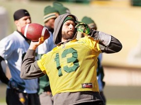 Eskimos quarterback, Mike Reilly runs a play during practice at Commonwealth Stadium on Thursday, on Sept. 11, 2014.