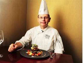 Fairmont Hotel Macdonald executive chef Serge Jost  prepares veal cheeks in Edmonton, Nov. 24, 2014.
