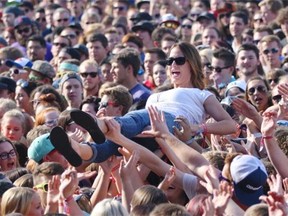 Fans of Cage the Elephant crowd surf at Sonic Boom on Saturday, Aug. 31, 2014.