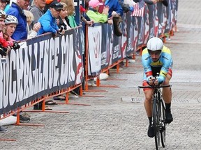 Fans line the route as Zach Bell, riding for Team Smartstop, races in the individual time trial during stage six of the 2014 USA Pro Challenge on Aug. 23, 2014, in Vail, Colo.