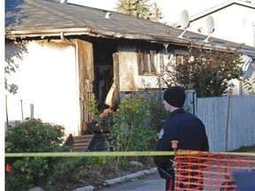 A fatal fire overnight in Callingwood claimed the life of a woman. Police were canvassing the neighbourhood and fire investigators were on scene at daybreak.  Shaughn Butts/Edmonton Journal