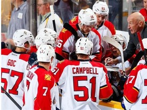 Florida Panthers assistant coach Craig Ramsay, right, draws up a play during a timeout in an NHL game against the Predators at Bridgestone Arena in Nashville on Oct. 15, 2013.