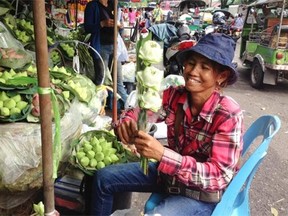 The flower market in Bangkok provides a scenic stroll for tourists.