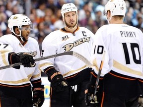 From left, Devante Smith-Pelly, Ryan Getzlaf and Corey Perry of the Anaheim Ducks discuss positions against the Los Angeles Kings in Game 6 of their second round NHL playoff series at Staples Center on May 14, 2014, in Los Angeles.