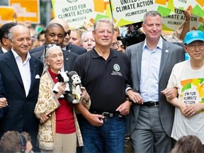 From left, French Foreign Minister Laurent Fabius, primatologist Jane Goodall, former U.S. Vice President Al Gore, New York Mayor Bill de Blasio and UN Secretary General Ban Ki-moon participate Sunday in the People’s Climate March in New York. They urged policy makers to take global action on climate change.