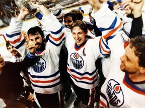 From left in front, Edmonton Oilers players Paul Coffey, Wayne Gretzky and Dave Lumley hold up the Stanley Cup after the team beat the New York Islanders 5-2 on May 19, 1984, to capture the National Hockey League title in five games. The ’84  win was the first of five for the Oilers, who had joined the NHL in 1979 as an expansion team from the World Hockey Association.