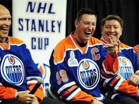From left, Mark Messier, Wayne Gretzky and Jari Kurri share a laugh at the 1984 Edmonton Oilers Stanley Cup team reunion at Rexall Place in Edmonton on Wednesday, Oct. 8, 2014.