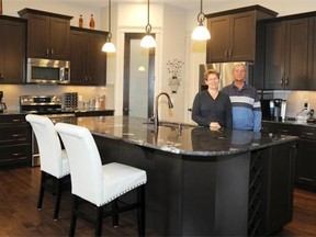 From left, Murielle and Philip Hill in the kitchen of their bungalow home in the Sherwood Park development of Summerwood