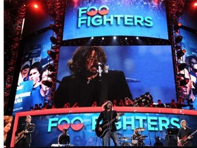 Frontman Dave Grohl of the Foo Fighters performs at the Time Warner Cable Arena in Charlotte, North Carolina, in this Sept. 6, 2012, file photo.