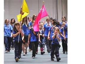 Girl Guides of Canada marching in the parade during the Remembrance Day Service ceremony in the Butterdome at the University of Alberta in Edmonton, Nov. 11, 2014.