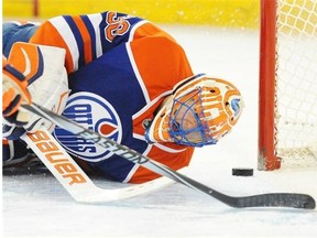 Goalie Ben Scrivens of the Edmonton Oilers can’t get to the puck as it approaches the goal line against the Anaheim Ducks at Rexall Place on March 28, 2014.