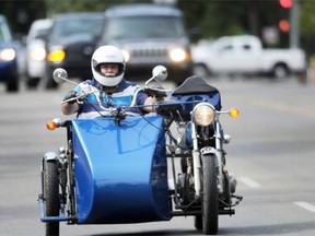 Gordon Cameron rides his modified 1978 Honda Matic CB 400 motorcycle on Whyte Avenue earlier this month. Cameron, an amputee due to diabetes complications, says the bike is fun, and has put some normalcy back in his life.