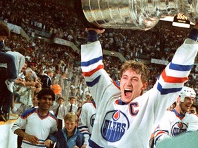 Then-Edmonton Oilers player Wayne Gretzky hoists the Stanley Cup in Edmonton in 1985.