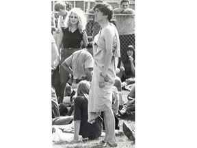 A hippie wrapped in a lavender-coloured sheet stands out from a crowd at the city’s first love-in in 1967.
