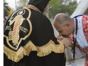 His Holiness Pope Tawadros II, the Coptic (Egyptian) Pope, gets his cross kissed upon arrival at St. Mary & St. Mark Coptic Orthodox Church in Edmonton on Wednesday, Sept. 17, 2014.
