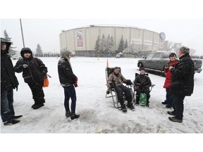 Hundreds of people lined up in the falling snow for tickets to the Foo Fighters concert outside Rexall Place in Edmonton on Saturday Nov 22, 2014.