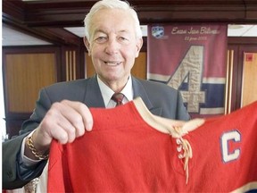 Jean Beliveau with a game sweater of his that was auctioned off in February 2005.