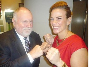 Jelena Mrdjenovich, WBC women’s featherweight champion, says Nick Lees insulted her and challenged him to fight in the ring. The bout is set for Nov. 26 at the Chateau Lacombe. Lees said he didn’t want to be knocked out in vain, and the rivals now say proceeds from the fight will benefit the Salvation Army’s Christmas hamper and toy drives and Santas Anonymous. They are pictured here at the Gold Medal Plates dinner at the Shaw Conference Centre last Thursday when nearly $300,000 was raised to support Canada’s Olympic athletes.