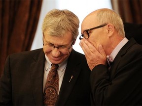 Newly minted Finance Minister Robin Campbell, shown here to the left of Health Minister Stephen Mandel, must look at reducing corporate and personal income taxes and increasing reliance on consumption-related levies, says Jack Mintz.